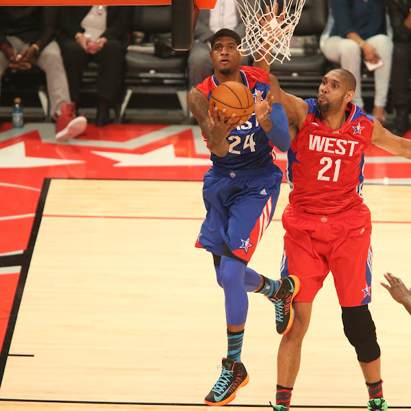 Paul George #24 of the Eastern Conference All-Stars goes up for the reverse layup against Tim Duncan #21 of the Western Conference All-Stars during 2013 NBA All-Star Game on February 17, 2013 at Toyota Center in Houston, Texas.